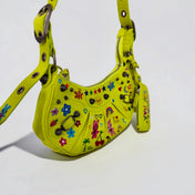 Fluorescent Yellow Balenciaga bag hand-painted by Humberto Cruz