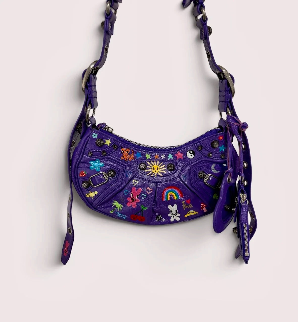 Purple Balenciaga bag hand-painted by Humberto Cruz