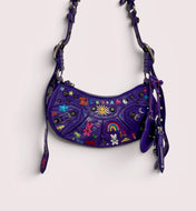 Purple Balenciaga bag hand-painted by Humberto Cruz