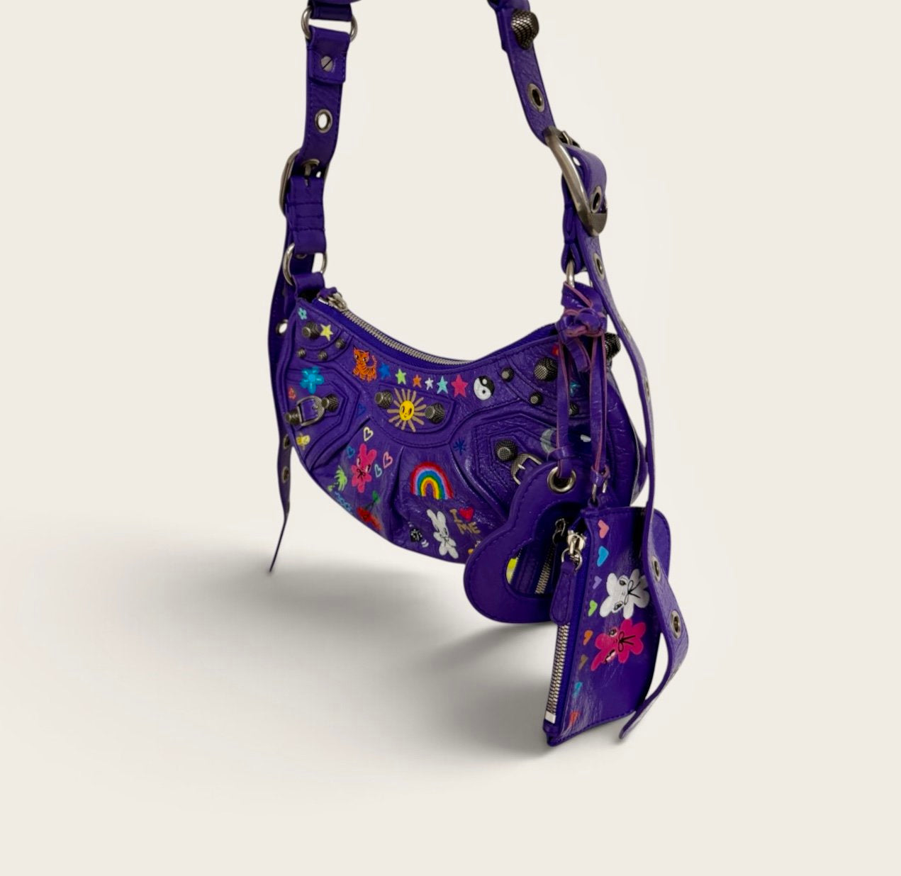 Purple Balenciaga bag hand-painted by Humberto Cruz